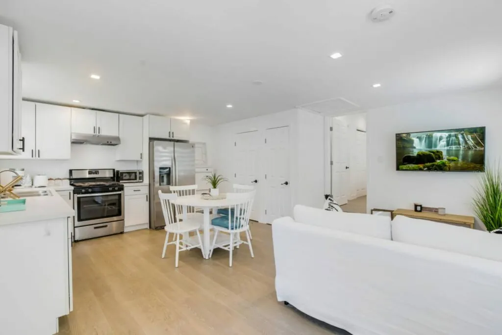 Bright white ADU kitchen and open living space
