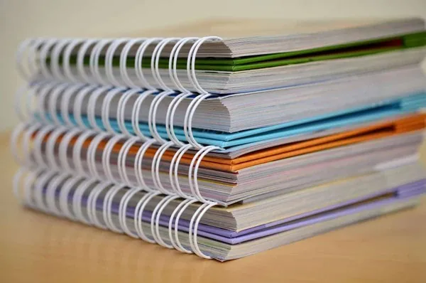 Stack of bound ADU conversion plan sets ready for permit submission